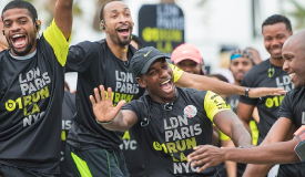 Team players celebrating in their custom branded merch.